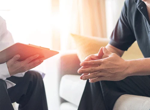 A doctor offering counsel to a patient.